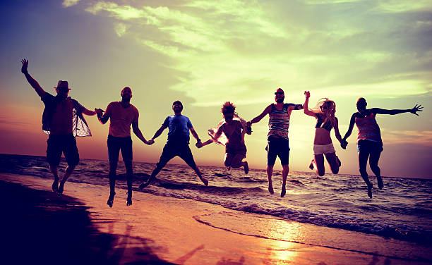 istock Diverse Beach Summer Friends Fun Jump Shot Concept 478898428
