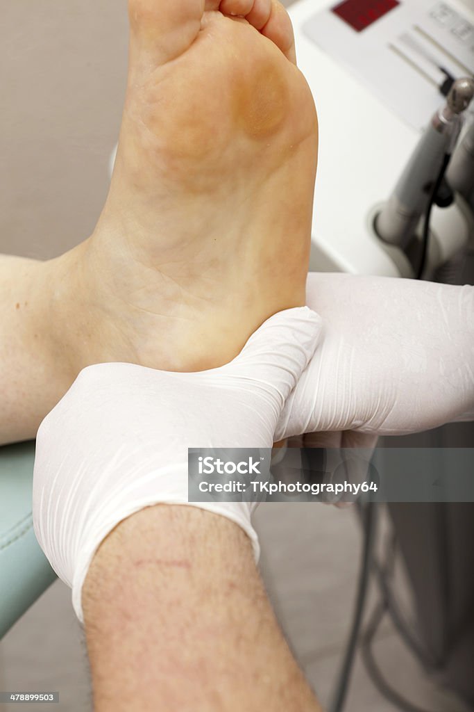 Foot massage at a chiropodist Relaxing foot massage after a complete foot care treatment Body Care Stock Photo