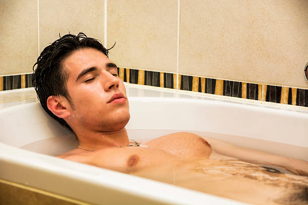 istock Handsome young man in bathtub at home having bath 478905742