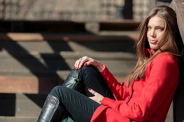istock Pretty young woman in red coat 478918117