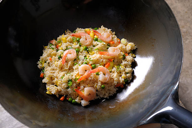 Fried Rice Fried Rice in chinese wok chinese cuisine fried rice asian cuisine wok stock pictures, royalty-free photos & images