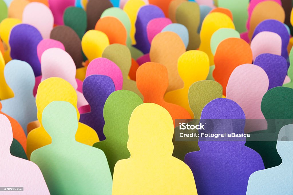 Anonymous crowd Lots of multicolored men and women silhouettes made with paper for crowd concept Community Stock Photo
