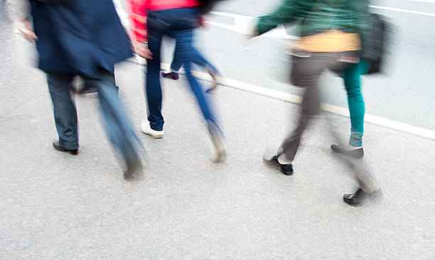 istock people leg walking on sidewalk in blur 478919634