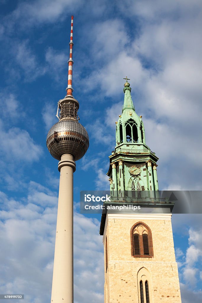 Berlin TV tower and St Mary's church tower Berlin TV tower and the bell tower of St Mary's church in Berlin, Germany. 2015 Stock Photo