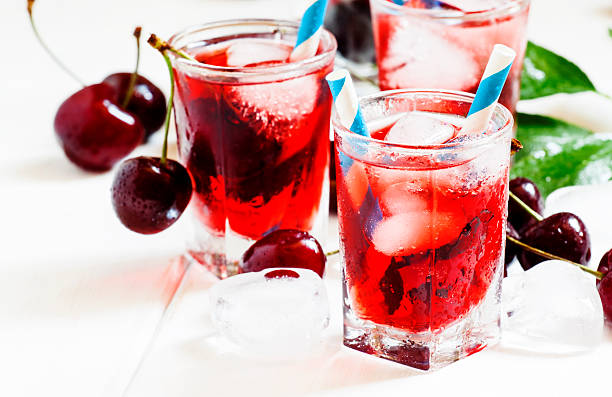 istock Cherry red drink with ice in a heart shape 478922112