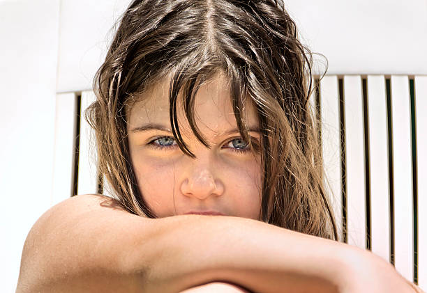 Young girl expressing disgust - isolated on white background with