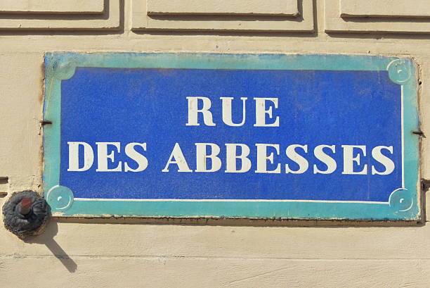 Street name sign of Rue des Abbesses in Paris, France
