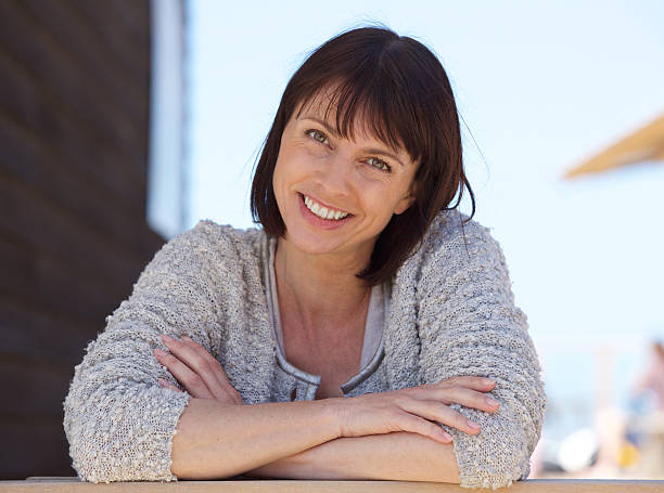 istock Confident middle aged woman smiling outside 478926200