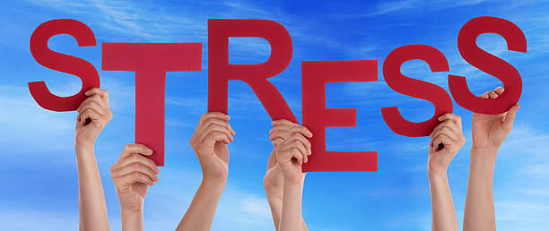 istock Many People Hands Holding Red Word Stress Blue Sky 478926500