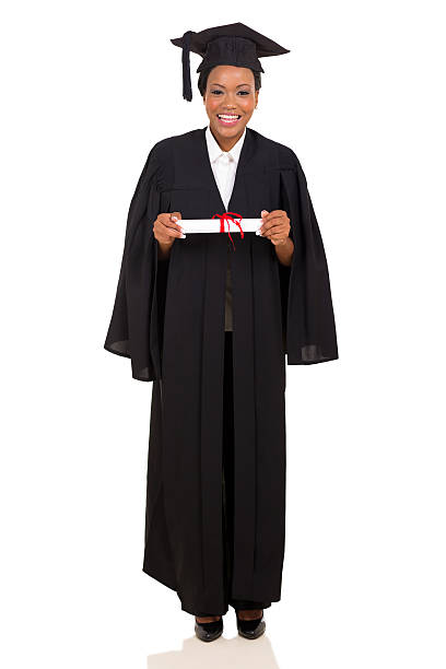 female college graduate in gown and cap - toga stockfoto's en -beelden