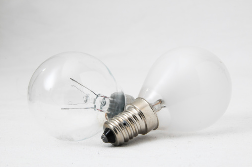 Two Different Old Incandescent Light Bulbs on a White Background