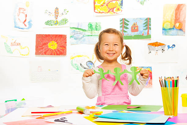 istock Girl and cut paper men 478932065