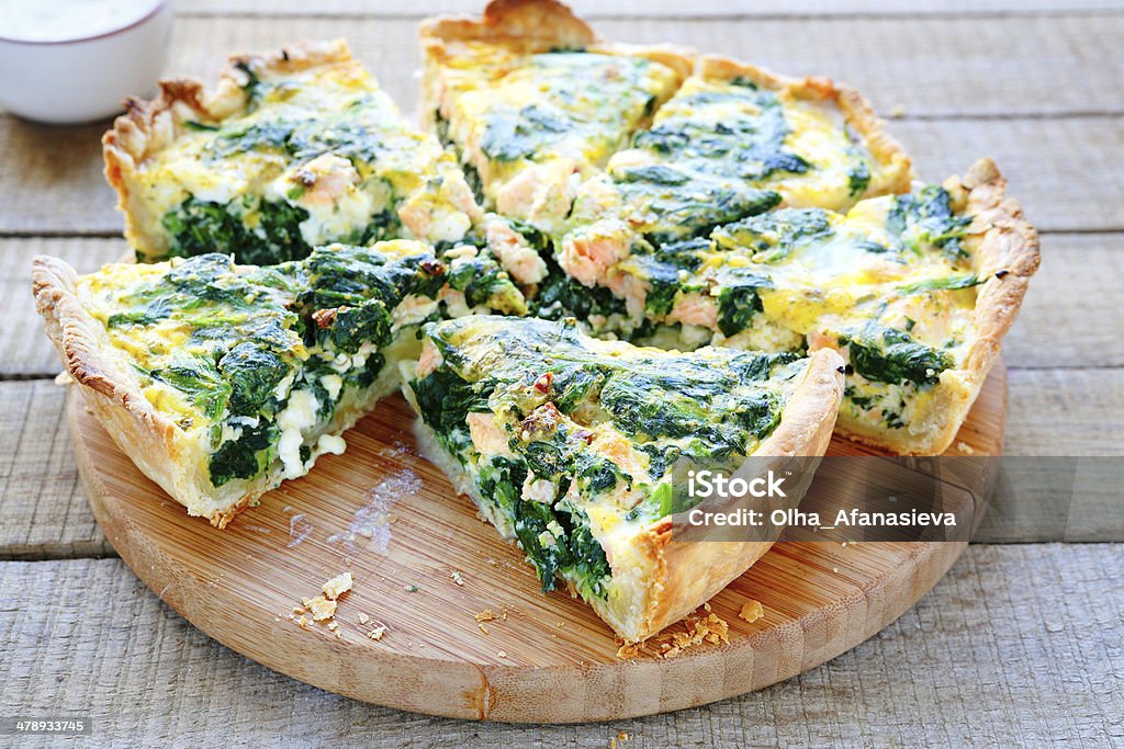 Round PIE with spinach and fish Round PIE with spinach and fish, food closeupop Spinach Stock Photo