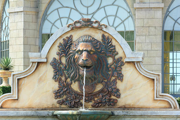 Statue of lion heads spout water