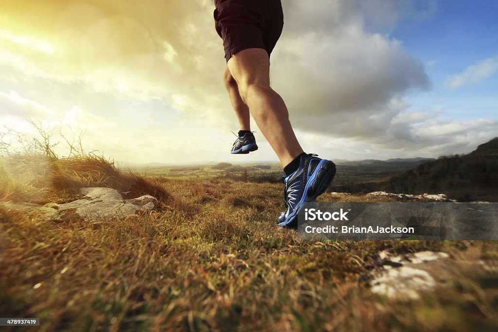 Healthy trail run Outdoor cross-country running in early sunrise concept for exercising, fitness and healthy lifestyle Cross-Country Running Stock Photo