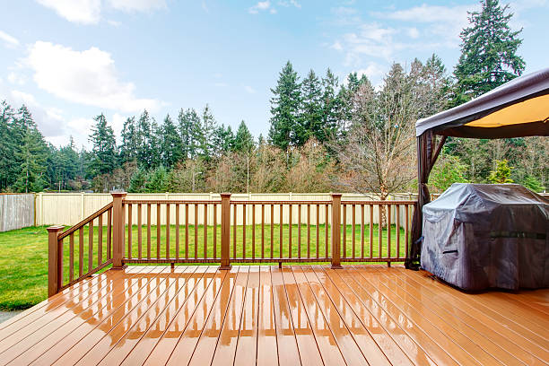 istock Backyard with wet deck, grill and fence. 478937841