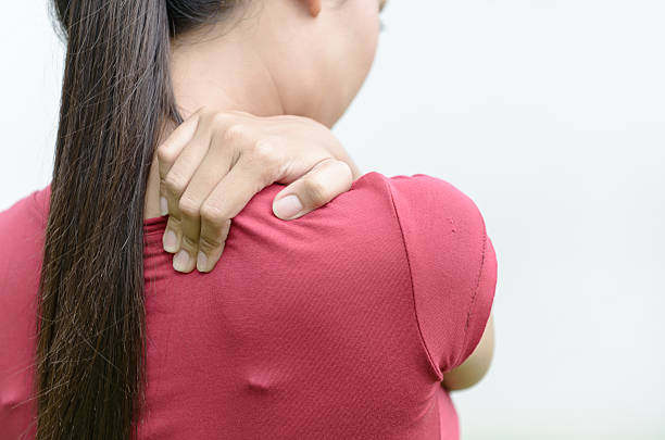 istock Woman massaging pain back 478938138