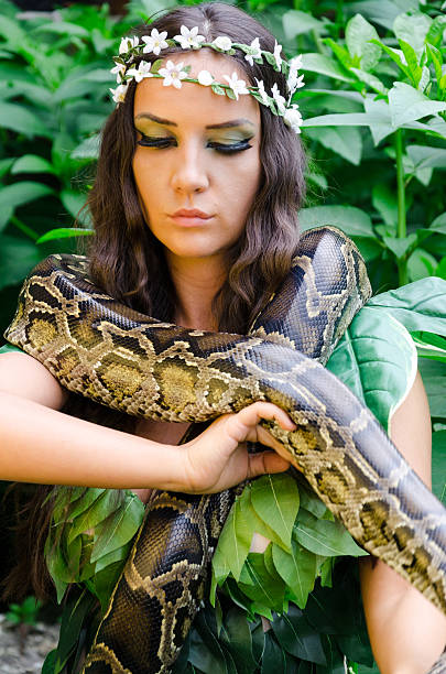 istock Beautiful girl holding a snake 478938774