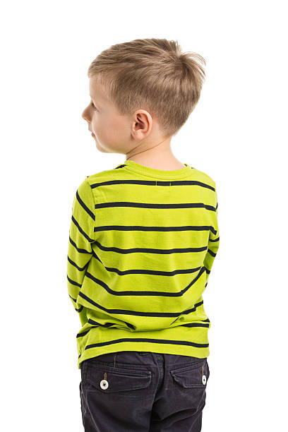 istock back of 7 years old boy standing 478938802