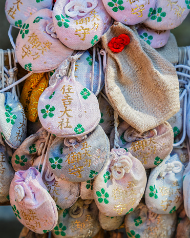 Osaka, Japan - October 24 2014: Japanese charms commonly sold at religious sites Shinto and Buddhist, provide various forms of luck or protection.