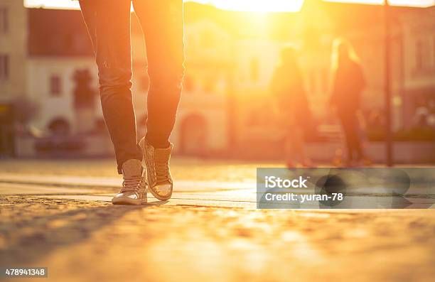 Womansfoots On The Street At Sunny Day Stock Photo - Download Image Now - 2015, Activity, Adult