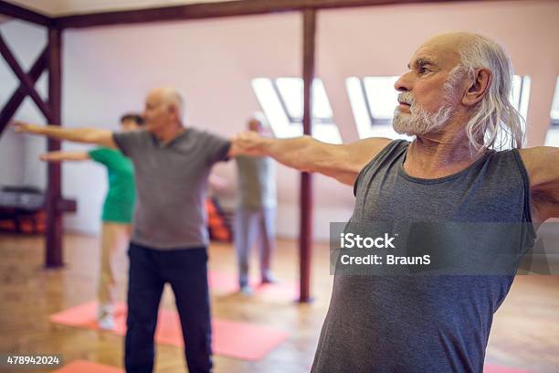 Elderly Man Exercising With His Arms Outstretched Stock Photo - Download Image Now - 2015, Active Lifestyle, Active Seniors