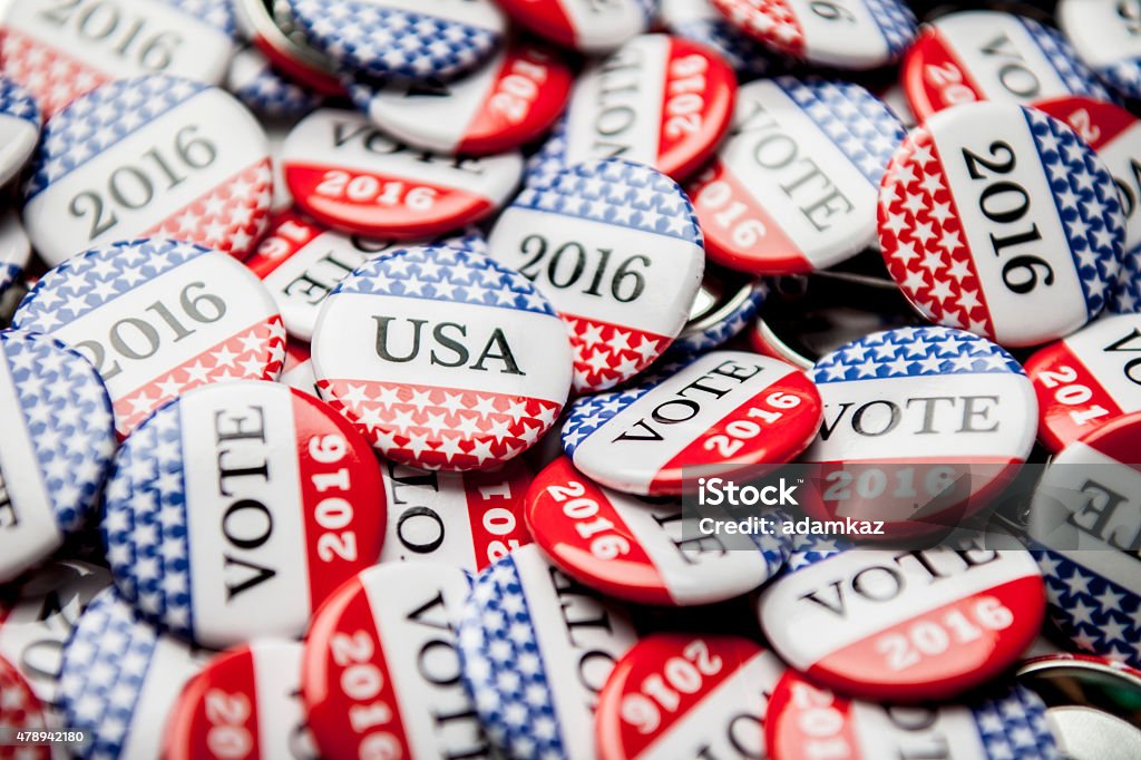 Election Vote Buttons Close up of Vote 2016 election buttons, with red, white, blue and stars and stripes. 2015 Stock Photo