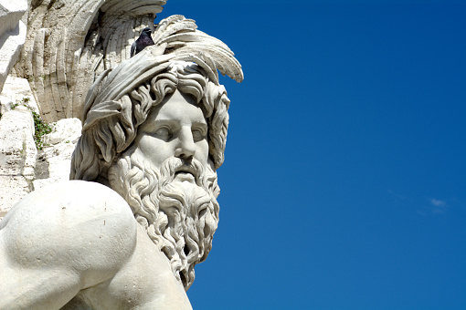 The best famous statue in Navona Square, Rome in the blue sky. Italy.