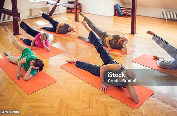 Above View Of Large Group Of Seniors Exercising At Class Stock Photo - Download Image Now