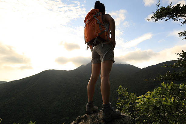 istock woman backpacker on mountain peak enjoy the view 478948568