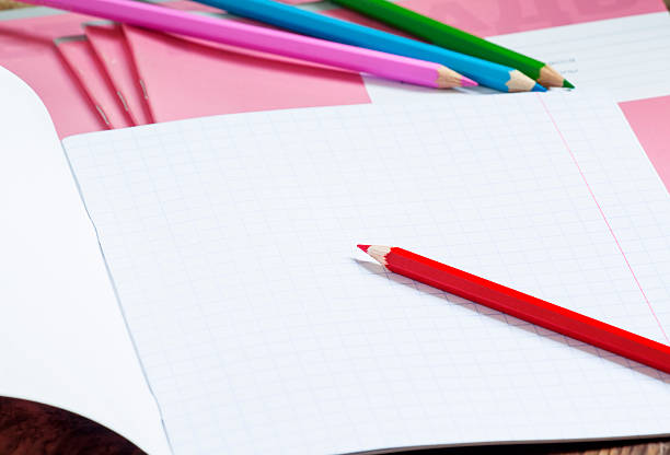 istock Pink school notebook in the box and colored pencils 478948682