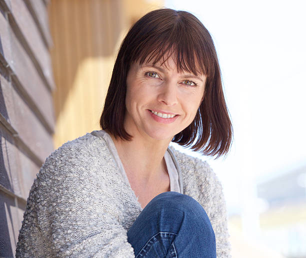 istock Mature woman smiling outdoors 478948986