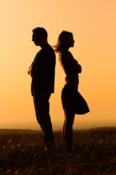 Relationship difficulties Silhouette of a angry woman and man on each other. rejection photos stock pictures, royalty-free photos & images