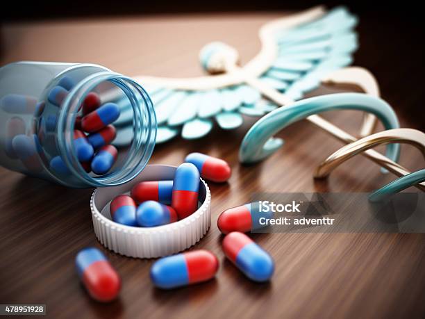 Pills On Wooden Table Stock Photo - Download Image Now - 2015, Backgrounds, Capsule - Medicine