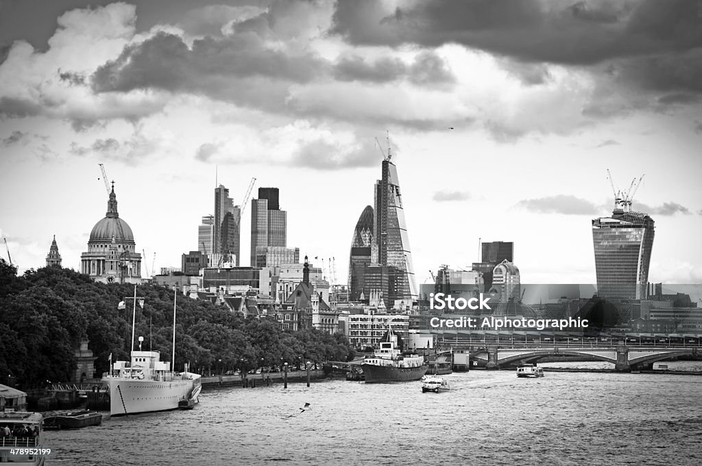 Skyline over the Thames in London A view of the Thames and London skyline looking South East and showing continued construction and the newly created skyscraper landmarks, 'The Gherkin, The Shard, The Walkie Talkie and the Cheese Grater' . Blackfriars Bridge is in the midground with barges and dredgers in the foreground. 122 Leadenhall Street Stock Photo