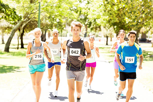 istock Male And Female Competitors Running Marathon 478958418