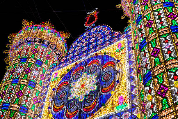 Las Fallas lighting on the streets of Valencia Valencia, Spain - March 9, 2014: The Falles is a traditional celebration held in commemoration of Saint Joseph in the city of Valencia, in Spain. The term Falles refers to both the celebration and the monuments created during the celebration. saint joseph stock pictures, royalty-free photos & images