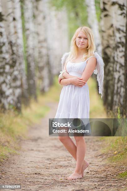Young Woman With Angel Wings On Back Stock Photo - Download Image Now - Angel, Women, Barefoot