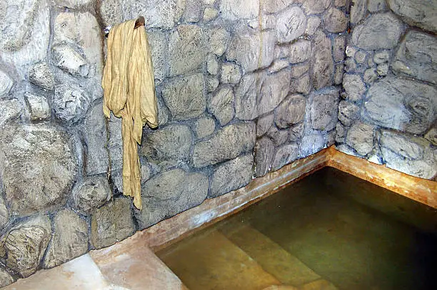 QUMRAN, ISR - SEP 27:Ancient mikvah on September 27 2007.It's a bath used for the purpose of the ritual immersion in Judaism according to the Jewish family purity law.