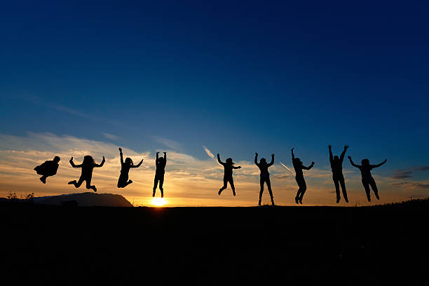 istock jumping friends at sunset 478967434