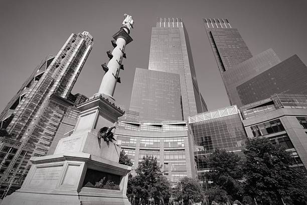 Columbus Circle New York City, United States - July 6, 2013: Architecture view of Columbus Circle on July 6, 2013 in New York. Columbus Circle with famous Time Warner Center skyscrapers completed in 2003 is one of New York landmarks. time warner center columbus circle pictures stock pictures, royalty-free photos & images
