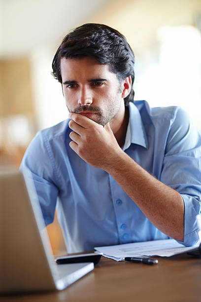 istock Contemplating his corporate situation 478976293