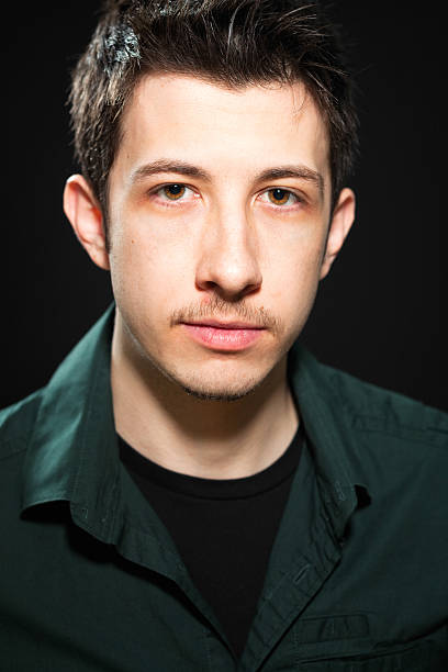 istock Serious young man low key portrait 478976531