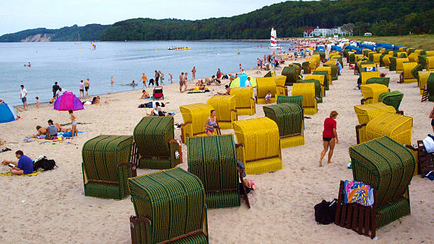 Binz, Germany - August 20, 2010: Beach of Binz,  Rügen island, Germany, with its typical canopied beach chairs and people enjoying the sun.