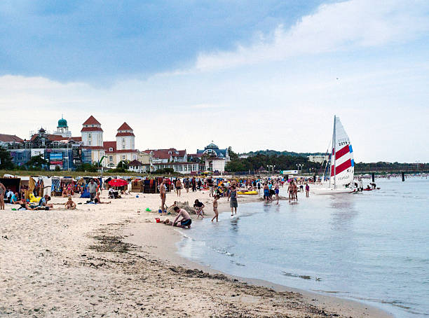 Binz, Germany - August 20, 2010: Beach of Binz,  Rügen island, Germany, with its typical canopied beach chairs and people enjoying the sun.