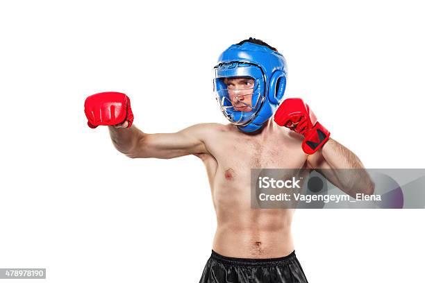 Fighter In Sports Helmet And Gloves Stock Photo - Download Image Now - 2015, Activity, Adult