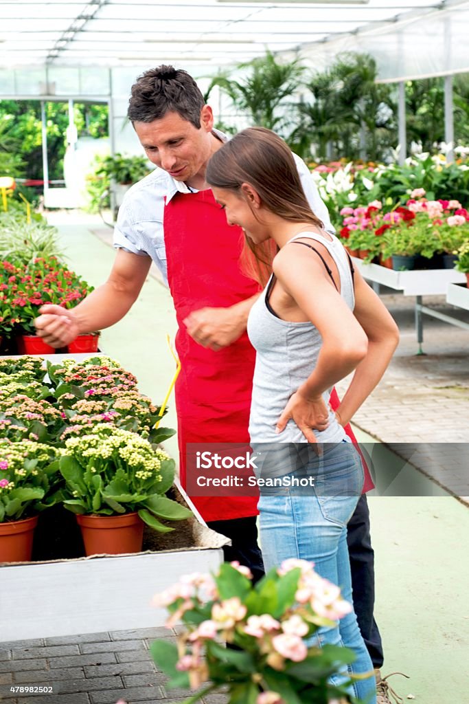 Clerk and Customer in a Garden Center Store 2015 Stock Photo