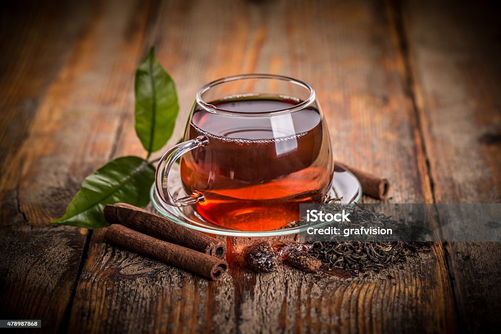 Cup of green tea Cup of green tea on a wooden table Black Tea Stock Photo