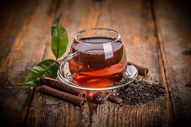 Cup of green tea Cup of green tea on a wooden table black tea stock pictures, royalty-free photos & images