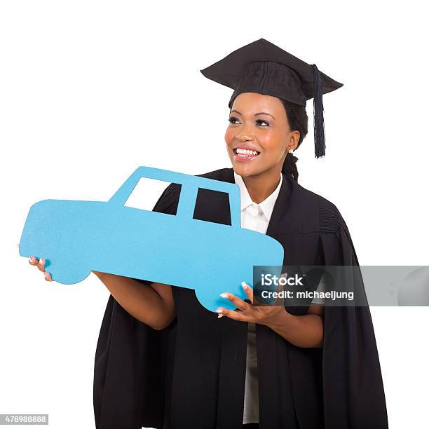 African American Female Graduate Holding A Car Symbol Stock Photo - Download Image Now
